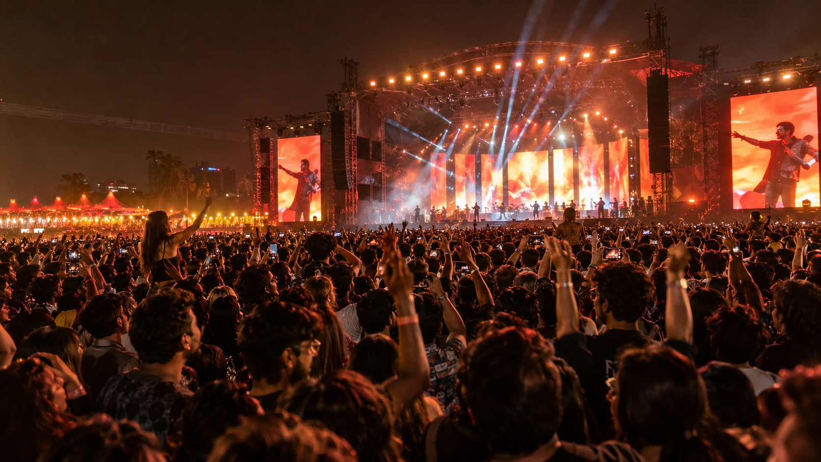 Large Indian live music audience watching a professionally produced concert